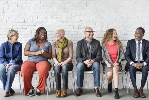 Diverse Group of People Community Togetherness Sitting Concept
